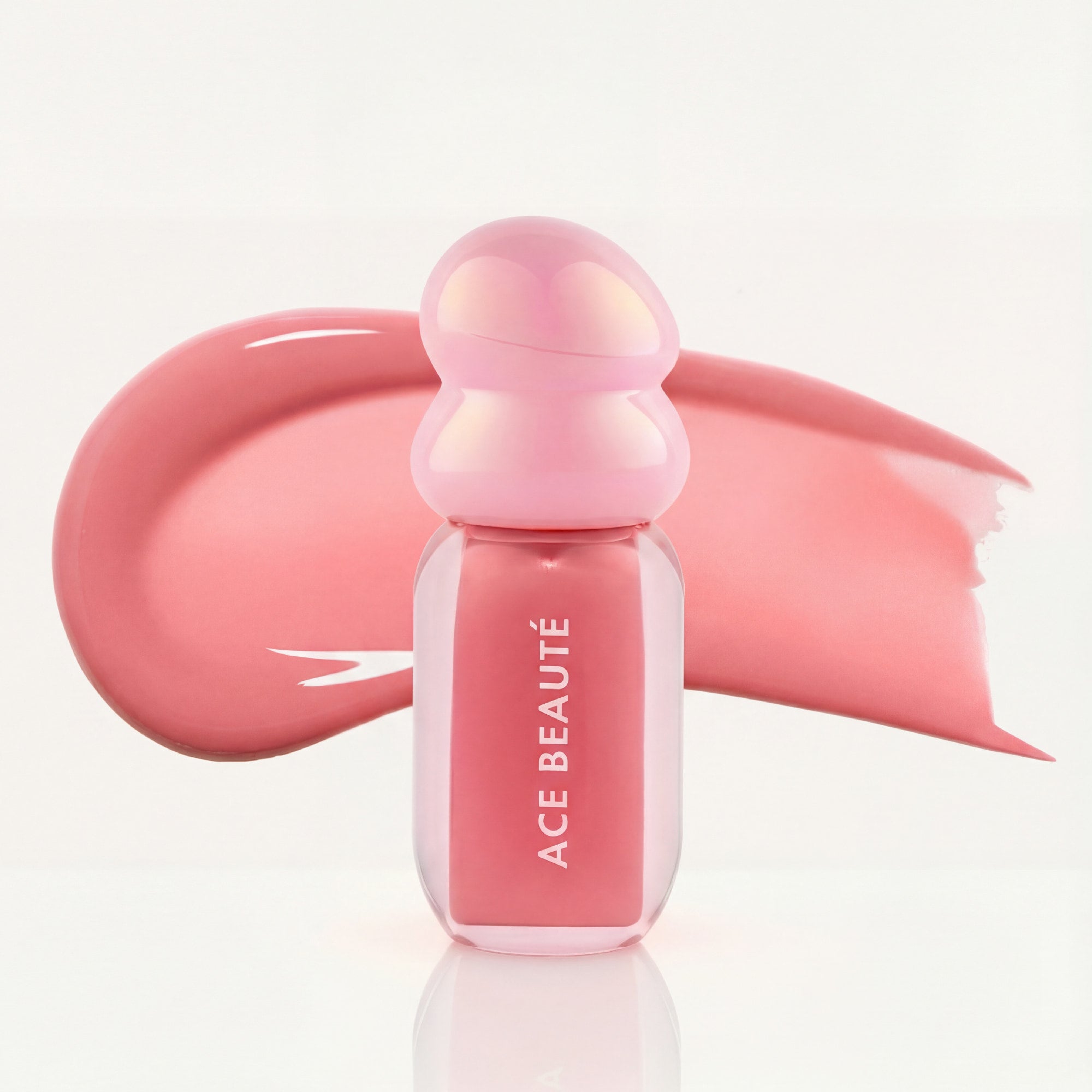 Petal Bloom lip gloss swatch showing pink nude shine