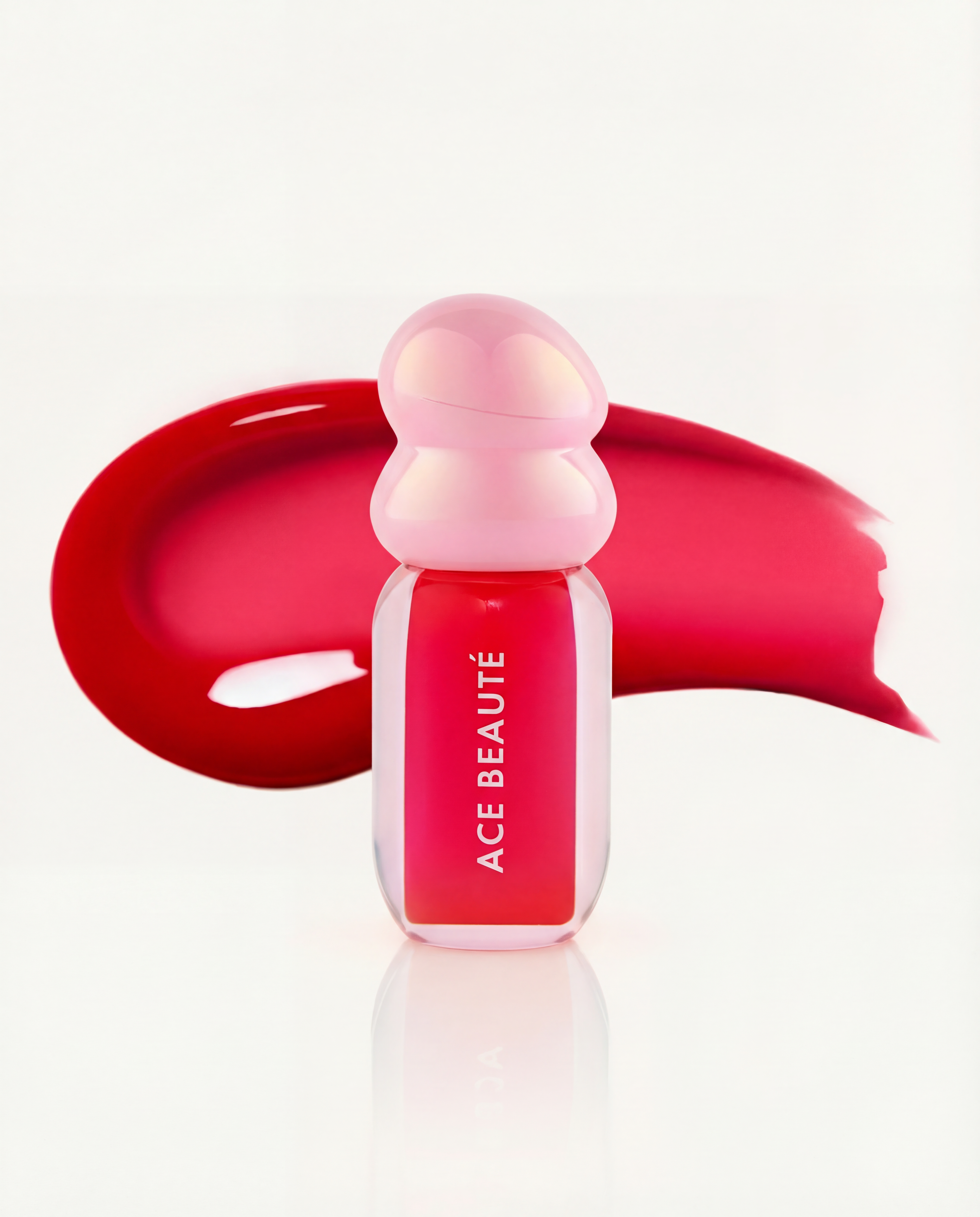 Aura Pop lip gloss texture swatch showing cherry tinted shine