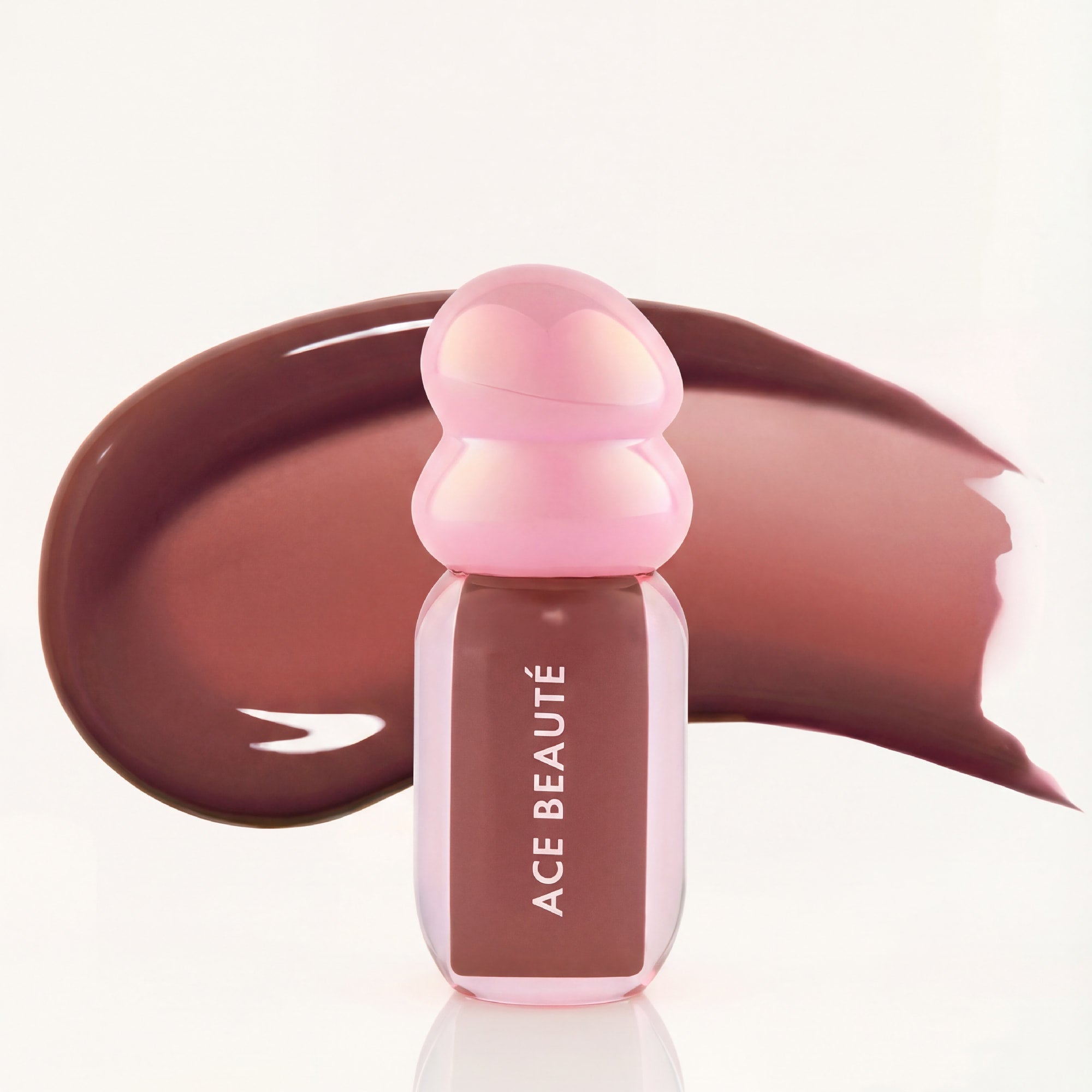 Sweet Intent lip gloss swatch showing milky brown shine