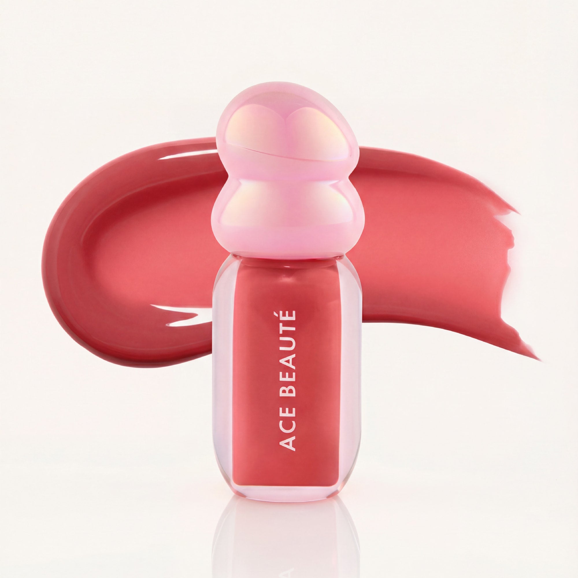 True Aura lip gloss swatch showing rose pink shine