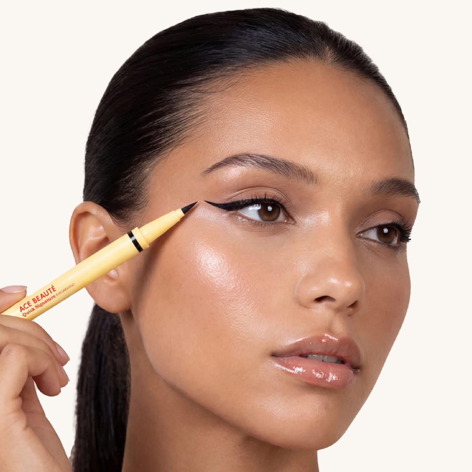 Applying liquid eyeliner to upper lash line
